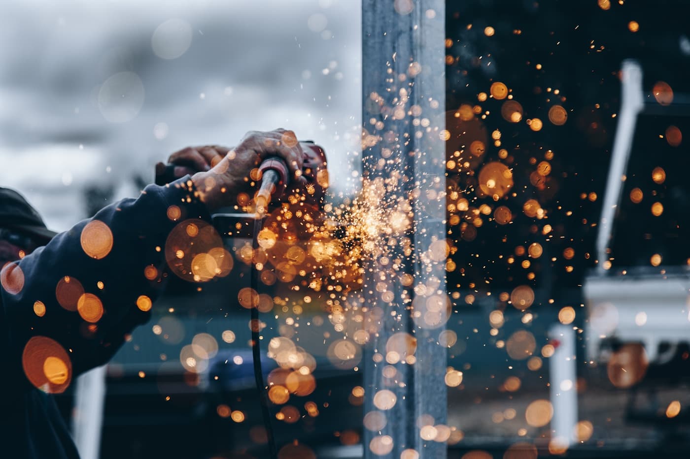 Industrial worker using fabrication equipment
